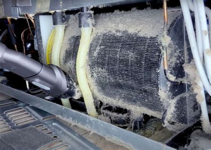 How do you clean refrigerator coils?